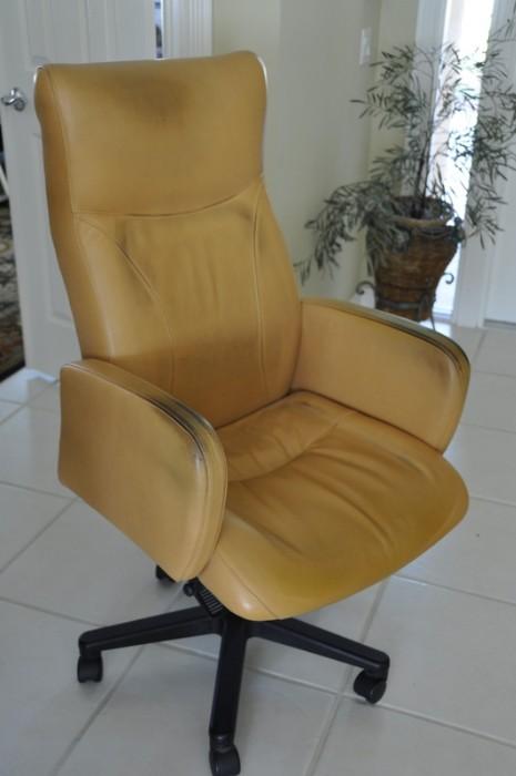 Leather desk chair, leather in tact but requires cleaning