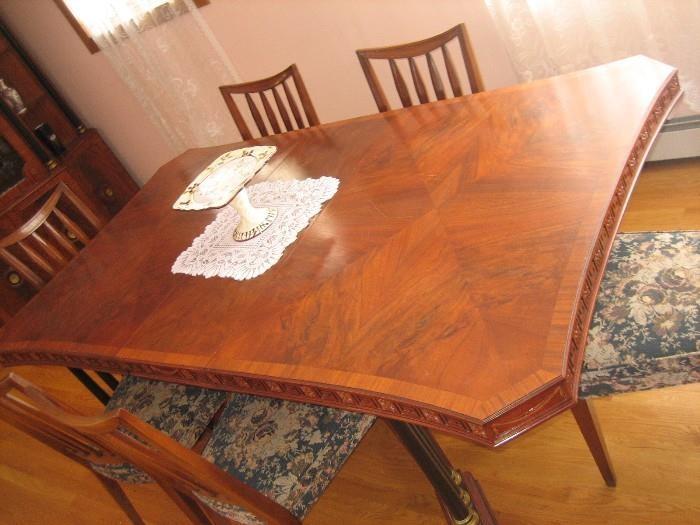 ABSOLUTELY GORGEOUS DINING ROOM SET. INCLUDES 10 CHAIRS + LEAFS. BEAUTIFUL DESIGN & ETCHING. FROM THE 20'S ERA. HAS MATCHING CHINA CABINET AND BUFFET. 22"deep 33.5" high by 80" wide. ASKING $2200 FOR THE SET.