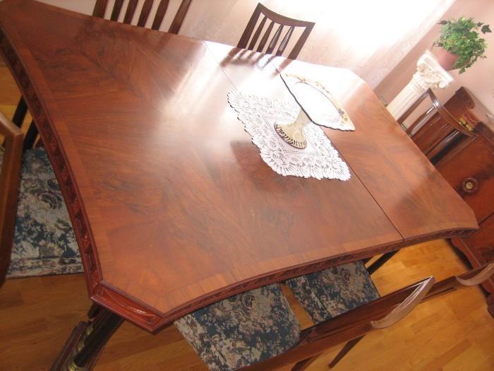ABSOLUTELY GORGEOUS DINING ROOM SET. INCLUDES 10 CHAIRS + LEAFS. BEAUTIFUL DESIGN & ETCHING. FROM THE 20'S ERA. HAS MATCHING CHINA CABINET AND BUFFET. 22"deep 33.5" high by 80" wide. ASKING $2200 FOR THE SET.