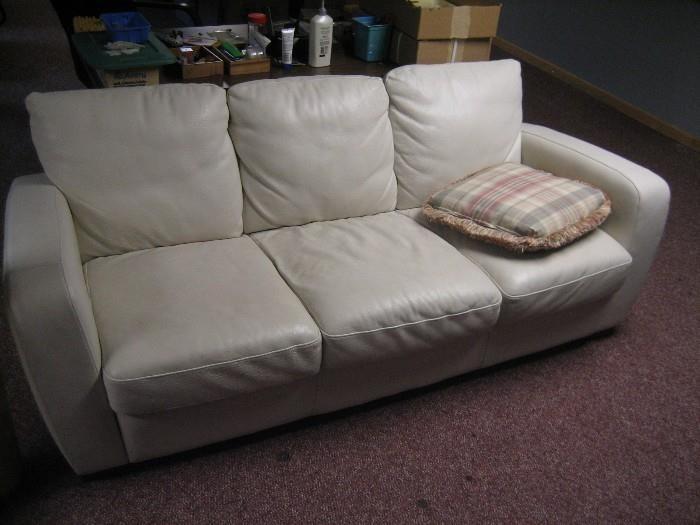 
WHITE LEATHER SOFA IN GOOD CONDITION. 80" wide by 36" deep $245