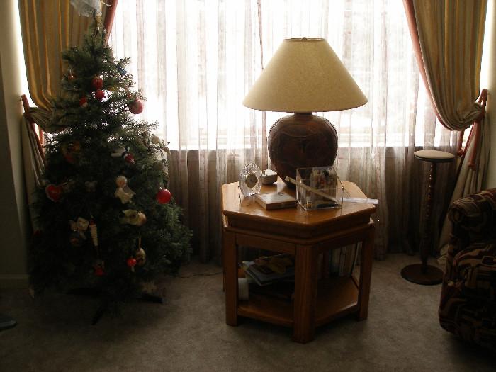 pottery lamp w/ deer carvings, oak end table, Christmas tree, decorations