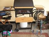 chair-Broil grill, luggage cart