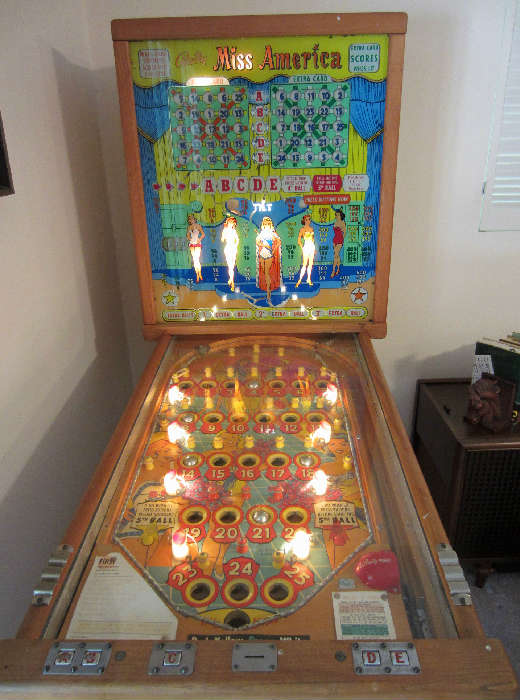 This is a vintage pinball machine ca,. 1957 titled "Miss America".  The machine has recently been repaired and lubricated by Mr. Pete Cliotis, 850-685-5268, who tested the machine and claims "everything seems to be working properly".  Mr. Cliotis is available for moving and maintaining the machine after purchase.  The machine is available for early purchase for $1200 which is the first day price.  The owner will entertain offers after the first day.