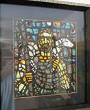 Butterfly wing wing art that presents as a leaded glass window.