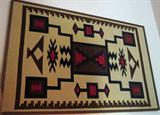 Large South American framed fabric wall hanging.
