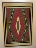 Large South American framed fabric wall hanging.