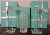Tiffany ad Co. 10 inch tall "Classic" candle sticks and 8 inch "Woven Cylinder" vase. With original boxes .... first time opened for this sale.