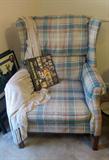 Wing back chair with matching ottoman.