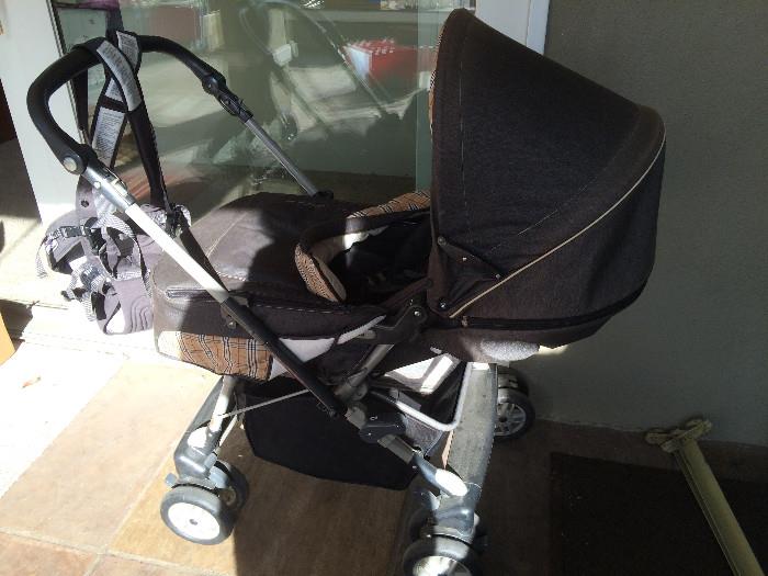 Chicco Brown Buggy/Stroll Brand New. Also A Chicco Body Baby Strap, Brand New.