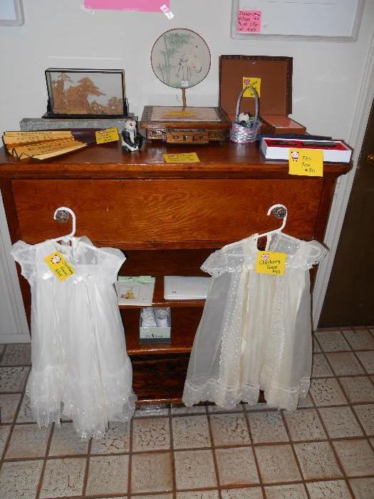 Christening Gowns and Dresser with open Shelves and many Chinese Games, Fans