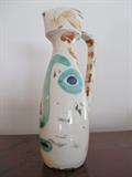 Picasso's, "Un Pichet Droit Visage", ceramic vase.              11 1/2" x 4".  Numbered 220 of 500.  