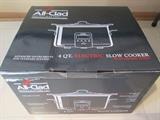 Brand new All-Clad 4qt slow cooker with enamel insert.  Chrome finish