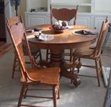Oak Table belonged to owner's grandmother from the early 1900's. It has 5 leaves and 8 chairs