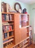 BOOKS AND A RATTAN BOOKCASE