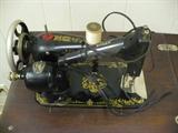 Very Old Singer Sewing Machine in original cabinet