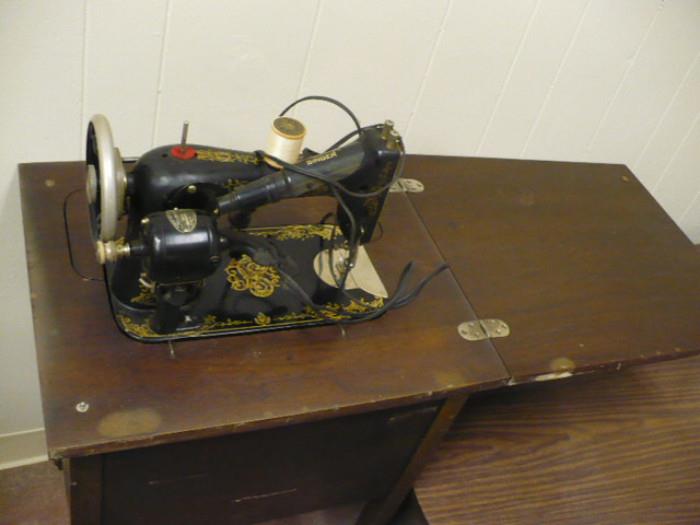 Very Old Singer Sewing Machine in original cabinet