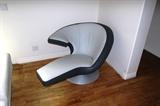 DESIGNER LEATHER CHAIR - ORIGINAL COST $6K