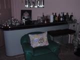 bar with lucite barstools