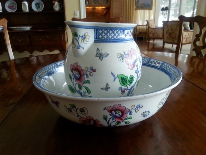 English late 19th and early 20th century polychrome porcelain pitcher and washbasin