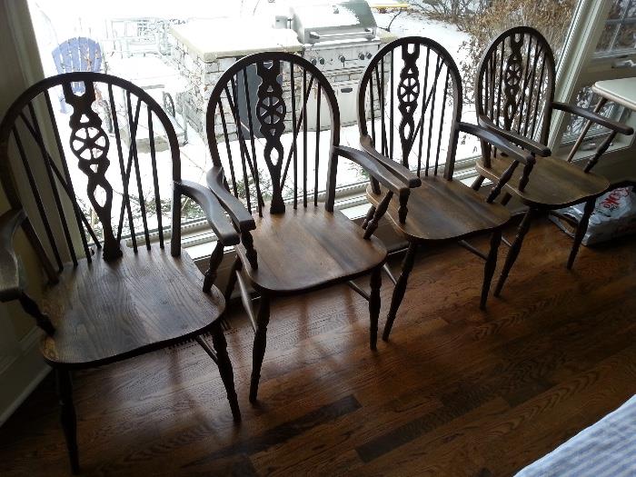 Four antique wheel-back English Windsor chairs