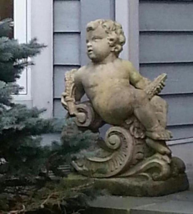 one of a pair of garden putti
