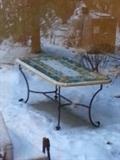 bad photo of a beautiful Italian ceramic top table with wrought iron base 