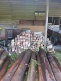 Landscaper's delight with lots of wood in varying sizes and bricks