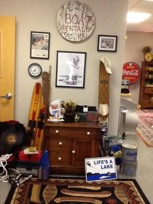 Round old wood 'Boat Rental' sign; framed water skiing related pictures; fish clock; kids double skis; 2-slaloms used for decoration;small orange fishing bucket; ski rope (1 good); antique wood cabinet; tackle boxes; fish finder w battery - see fish from dock! A&M hat (very valuable); 