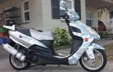 2006 WUSSI Coyote MIX 150cc Scooter (less than 3k Miles): Custom made from Baron Motorcycles for the Puerto-Rico Market, imported to US with limited Silver-Camouflage Fairing, CD-Player & Toolkit (not running due to sitting all winter, will jump start but not turn over & run).  We are also selling a Motorcycle Ramp which might help aide in loading this onto your vehicle…