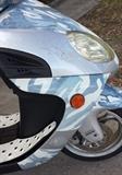 2006 WUSSI Coyote MIX 150cc Scooter (less than 3k Miles): Custom made from Baron Motorcycles for the Puerto-Rico Market, imported to US with limited Silver-Camouflage Fairing, CD-Player & Toolkit (not running due to sitting all winter, will jump start but not turn over & run).  We are also selling a Motorcycle Ramp which might help aide in loading this onto your vehicle…