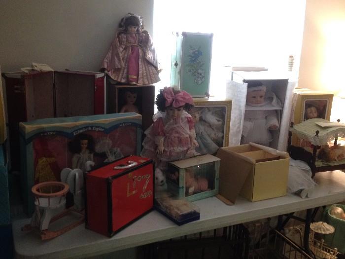 Massive doll collection, including vintage and antique dolls in boxes, as well as modern collector dolls.