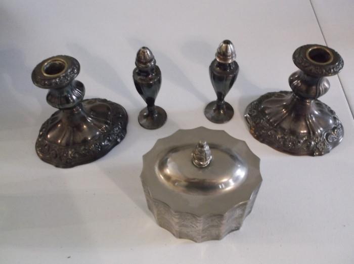 Silver candle holders with salt and pepper shakers