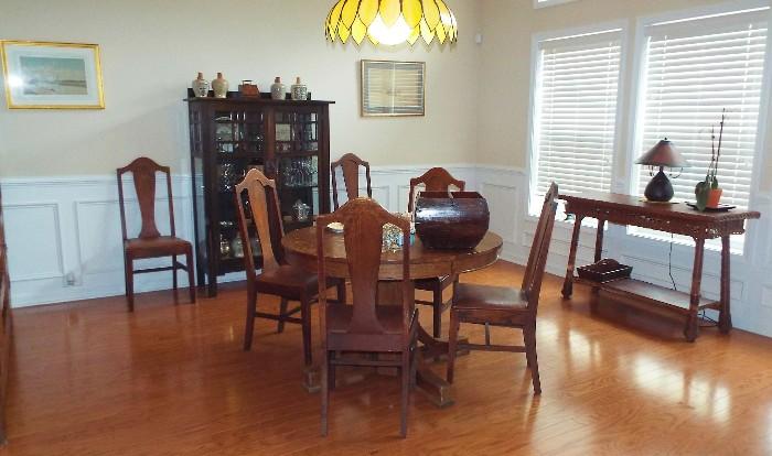 GREAT ANTIQUE MISSION STYLE PEDESTAL OAK TABLE AND OAK CHAIRS WITH STRONG GUSTAV STICKLEY ARTS AND CRAFTS INFLUENCE-HANGING LAMP WILL ALSO BE FOR SALE