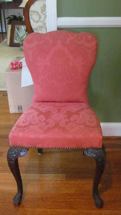 .Lovely slipper chair in coral fabric.