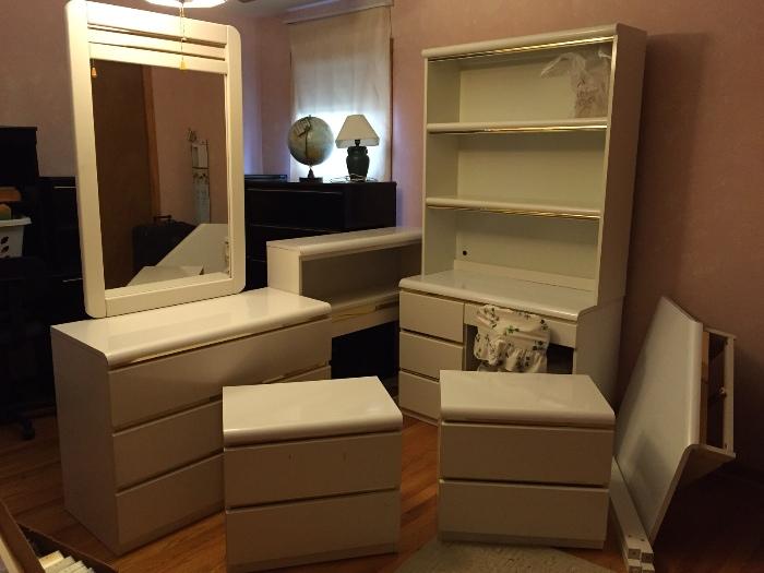 White laminate bedroom set, twin-size bookshelf headboard with dresser & mirror, desk & hutch, and corner desk or vanity. Includes rolling chair.  Very nice!