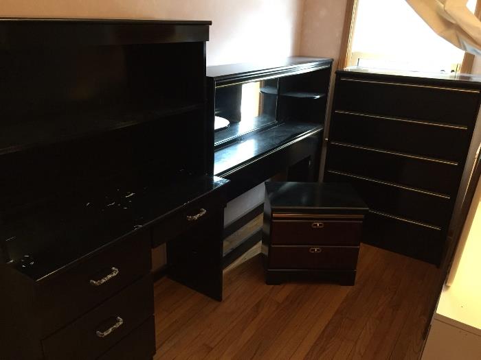 Black laminate bedroom set, queen size (could also be used with full size).  Mirrored bookshelf headboard, tall dresser, end table & desk with hutch.  Good condition!