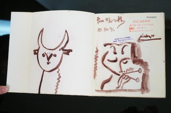 Lot 2:  Picasso Attributed Ink Drawing inside cover of Picasso art book.  : Dimensions:  H: 7.5 inches: W: 6.5 inches --- US Shipping charge: $20
