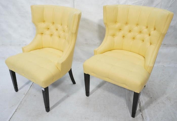 Lot 8:  Pair Dorothy Draper Style Chairs. Shaped Backs with Yellow Fabric and Black Legs.  Button and Tufted.: Dimensions:  H: 33 inches: W: 37 inches: D: 27 inches --- 