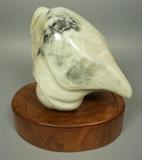Lot 82:  MARGERY BLUMENTHAL  Carved Stone Modernist Sculpture.  "Maternity Watch". Carving mounted on wood base. Has exhibition tag. : Dimensions:  H: 11.5 inches: W: 12 inches: D: 7 inches --- 
