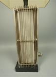 Lot 85:  Industrial Table Lamp. Thin steel rods form column on square black base.: Dimensions:  H: 37.5 inches: W: 14 inches: D: 14 inches --- 