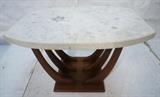Lot 95:  Terrazzo Top Side End Table on Dark Walnut Base. Bowed sides top with inlaid marble elements. Three U shaped legs on base. : Dimensions:  H: 20.75 inches: W: 30 inches: D: 20.5 inches --- 