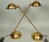 Lot 388:  Pr Modernist Brass Long Arm Desk Table Lamps. Domed base and shades. : Dimensions:  H: 21.5 inches: W: 19 inches: D: 7.25 inches --- 