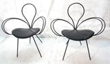 Lot 402:  Pr Decorative Iron Side Chairs. Double flourish arms. Black upholstered seats: Dimensions:  H: 32.25 inches: W: 28.5 inches: D: 20 inches --- 