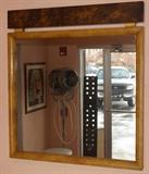 Lot 405:  Italian Leather covered Wall Mirror. Tan Leather frame with oil spot leather top detail. Aldo Tura style.: Dimensions:  H: 34 inches: W: 31 inches --- 