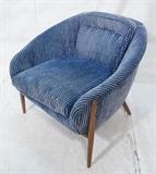 Lot 445:  Barrel Back Lounge Chair. Tapered wood peg legs. Striped blue fabric. : Dimensions:  H: 28 inches: W: 34.5 inches: D: 32 inches --- 