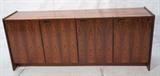 Lot 455:  Rosewood Four Door Credenza Sideboard. Danish Modern. Recessed wood pulls. Danish control label: Dimensions:  H: 32 inches: W: 78.5 inches: D: 18.25 inches --- 