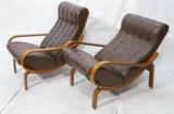 Lot 492:  Pr WESTNOFA Norway Brown Leather Lounge Chairs. Wood Frame. Chairs slide to recline. Label: Dimensions:  H: 35 inches: W: 28 inches: D: 34 inches --- 