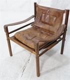Lot 494:  Vintage Modern Safari style Lounge Chair. Leather Seat cushions and arm straps. : Dimensions:  H: 26 inches: W: 24.5 inches: D: 24 inches --- 