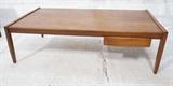 Lot 499:  Danish Teak Vintage Modern  Coffee Table. One drawer. Tapered square legs. JOHN STUART mark. : Dimensions:  H: 16 inches: W: 54 inches: D: 28 inches --- 