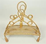 Lot 528:  Decorative Gilt Iron Italian Magazine Rack. Tassel details.: Dimensions:  H: 20 inches: W: 1818.5.05 inches: D: 8.5 inches --- 